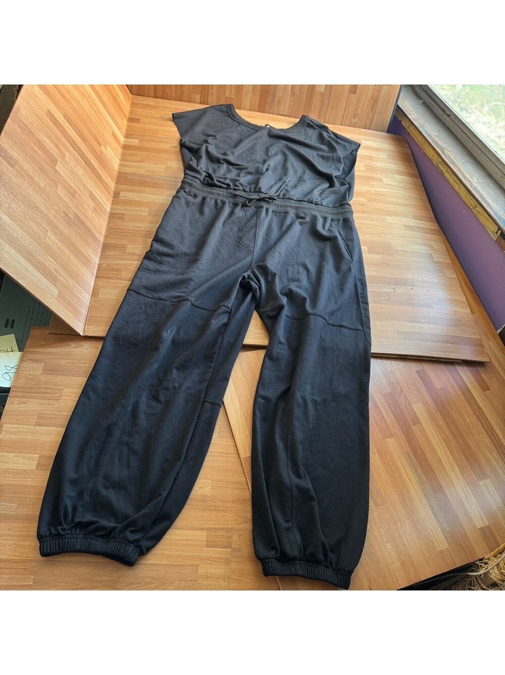 Black one piece, sleeveless jumpsuit size XL elastic ankle